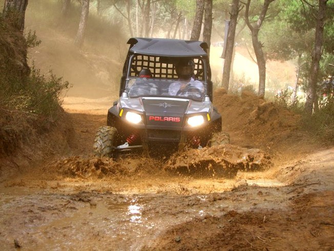 Photo of Tanios Samaha on his Polaris Side by Side ATV crossing mud bog during Speed Test Lebanon 2010