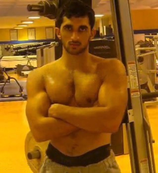 Sexy Arab Prince Muscles Sheikh Rashid al Maktoum at the gym working out and flexing photo